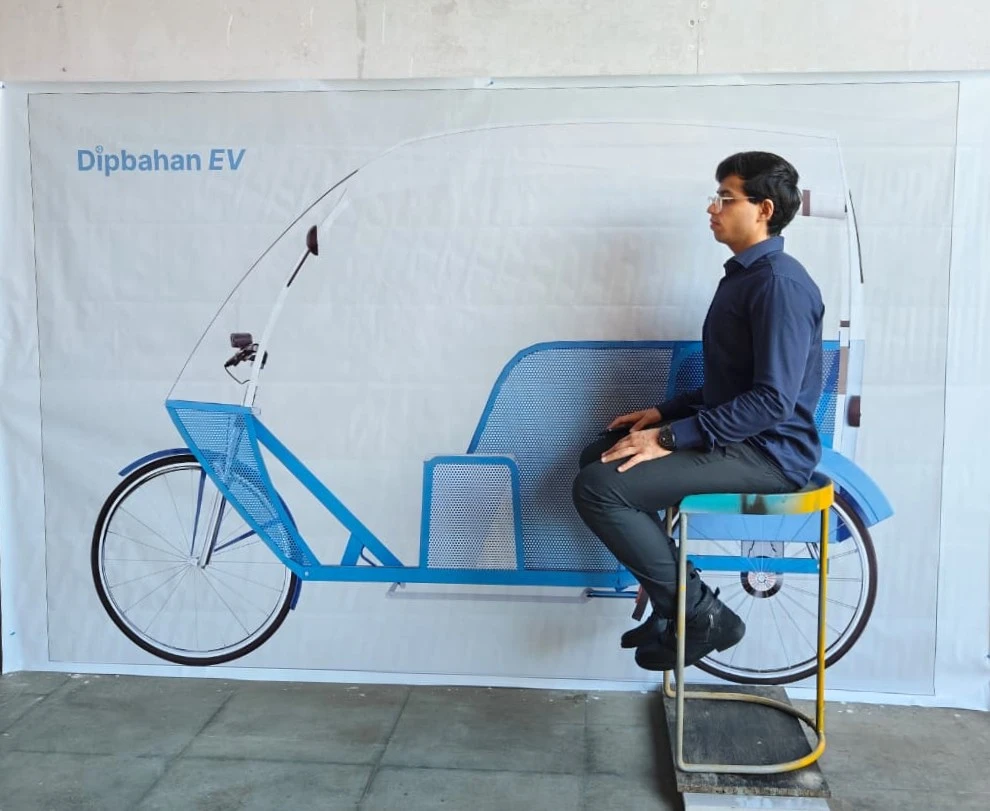 Ansh Bathija checking seating ergonomics against the Dipbahan EV print